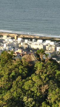 Morro do Lampiao, Campeche in Floprianopolis. Aerial view in vertical video