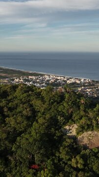 Morro do Lampiao, Campeche in Floprianopolis. Aerial view in vertical video