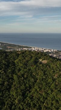 Morro do Lampiao, Campeche in Floprianopolis. Aerial view in vertical video