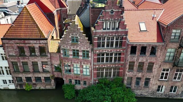 Aerial Over Graslei Canal in Ghent Belgium with Historic Guild Houses and Seagulls