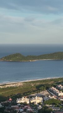 Morro do Lampiao, Campeche in Floprianopolis. Aerial view in vertical video