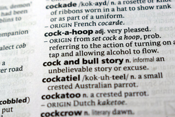 Fototapeta premium English Dictionary Page Close Up With The Word Definition Of - cock-a-hoop