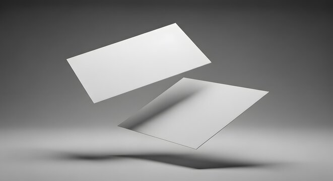Floating white cards in a minimalist setting a study in light and shadow dynamics