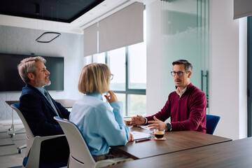Fototapeta na wymiar Male candidate talking to human resource managers during job interview in office.