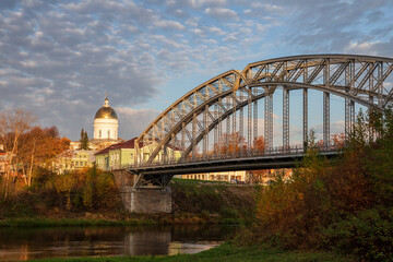 Fototapeta premium Belelyubsky Bridge in Borovichi. The first arch bridge in Russia, built in 1905