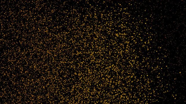 Abstract orange particles on black background dots pattern art texture effect