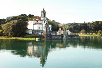 Obraz premium The Cemetery of Niembro and Our Lady of Sorrows church in Barro, Asturias