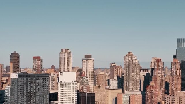 Stunning aerial view of new york city skyline during day, iconic skyscrapers and architectural wonders define urban landscape.