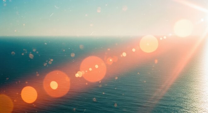 Golden sunset light flares over calm ocean water. Beautiful horizon with warm beam glares and sparkles. Concept of peaceful nature landscape, summer vacation bliss and serenity background.