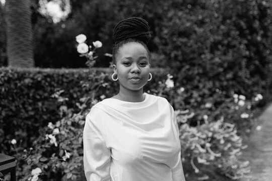 Young elegant black woman at a formal event in black and white