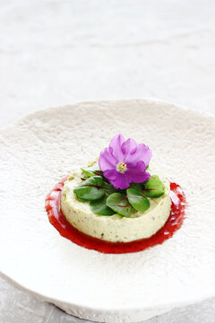 Hummus with sorrel microgreens and violets