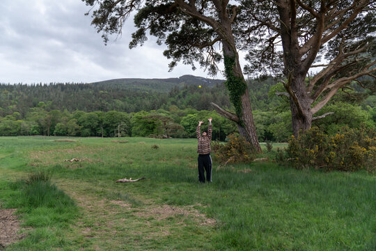 Person playing catch with a ball outdoors in wicklow mountains