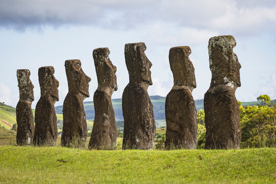 Ancient Moai statues stand in a line on Easter Island