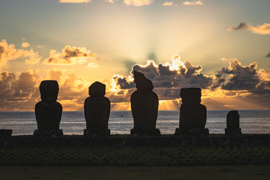 Easter Island Moai statues silhouetted at sunset