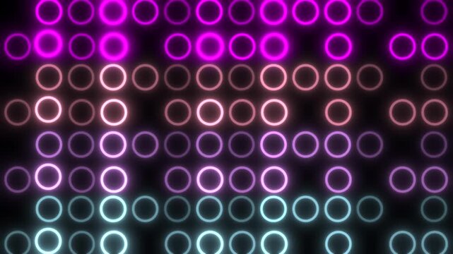 Glowing colorful digital circles on vibrant LED display
