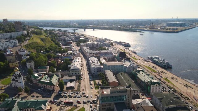 Aerial drone forward flight over the Nizhne-Volzhskaya Embankment featuring Nizhny Novgorod Kremlin walls and the Volga River panorama