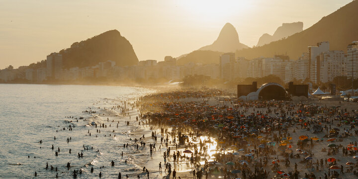 Panorama of Copacabana beach crowded at sunset, Rio de Janeiro, Brazil