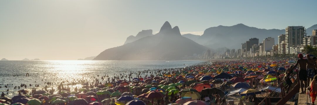 Panoramic of Ipanema beach crowded at sunset, Rio de Janeiro, Brazil