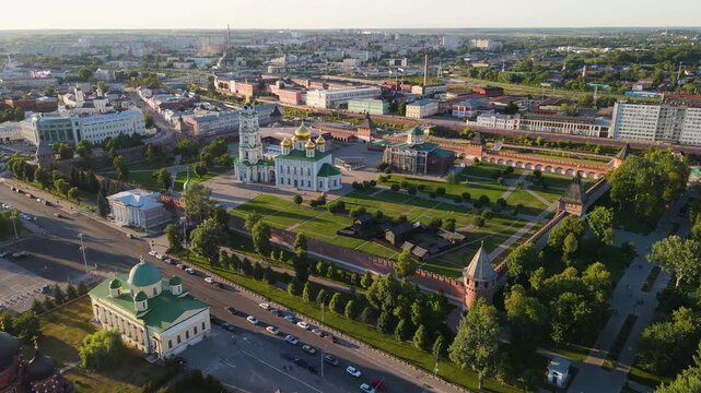 Aerial view of Tula Kremlin at sunset, Russia. Ancient brick fortress with towers and golden domes of Assumption Cathedral. Historic landmark and city center of Tula from drone