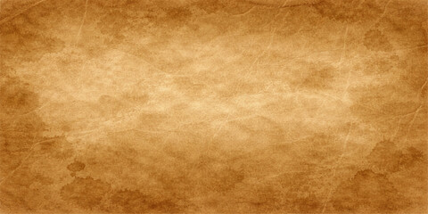 Fototapeta premium Ancient vintage parchment with a stained grunge texture provides a worn brown paper background and aged antique surface for a retro design