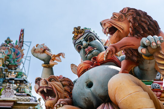 Statue of the goddess Badrakali woth trident and flanked by lions on the roof of the Sri Badhrakali Amman Hindu Kovil, Trincomalee, Sri Lanka