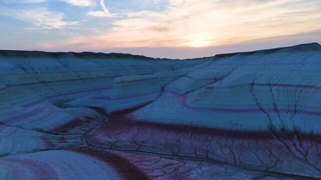 multicolored canyon at sunset Kyzylkup is a natural landmark in the Mangystau region of Kazakhstan. It is a group of colorful hills with multicolored layered slopes that resemble the Italian dessert t