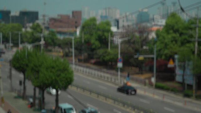 Blurred out of focus view to street road full with traffic cars and buses transportation