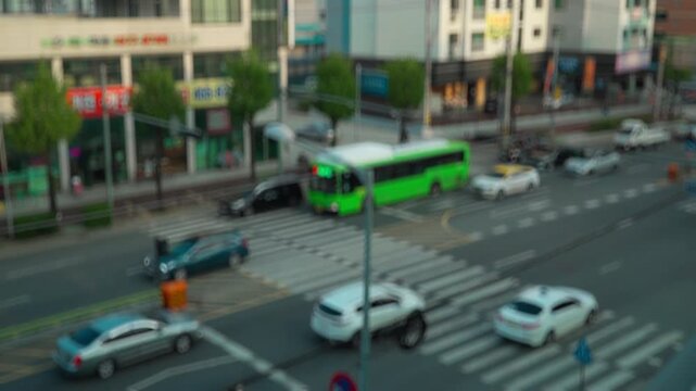 Blurred out of focus view to street road full with traffic cars and buses transportation