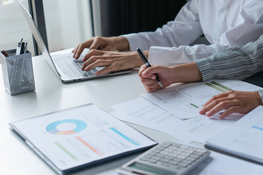 Accountant group meets to collaborate and finalize project figures
