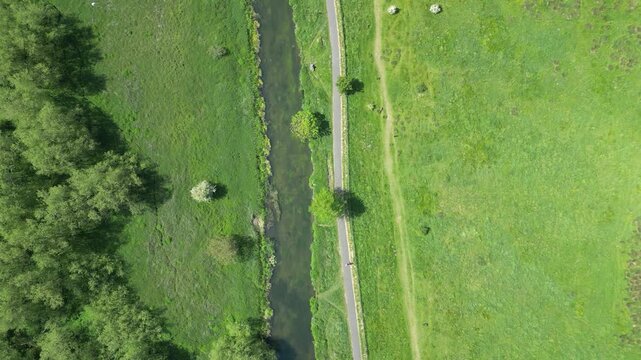 Birds Eye Drone View of River Stour Winding Through Lush Green Meadows Canterbury Kent UK