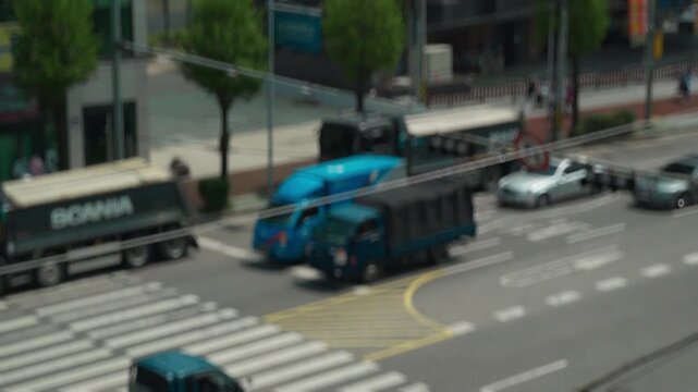 Blurred out of focus view to street road full with traffic cars and buses transportation