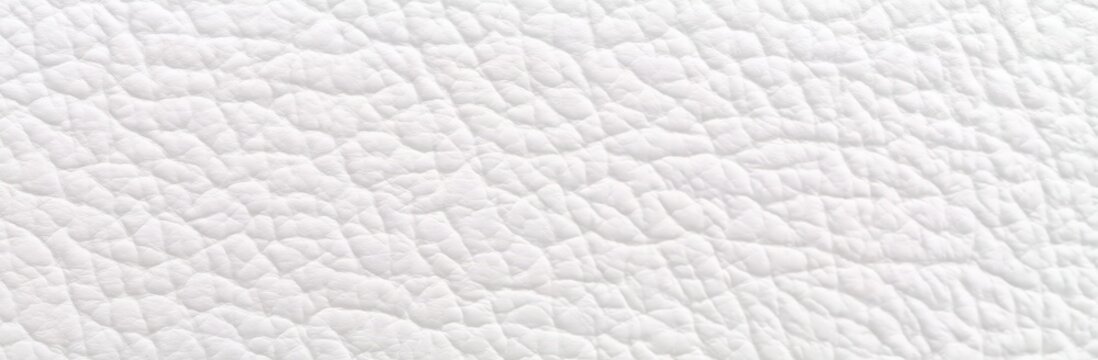 Close-up texture of white leather showing natural grain and creases.