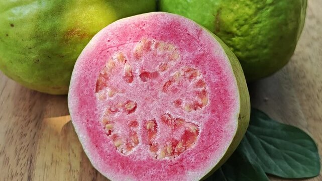 Pink guava on wooden board. Zoom in.