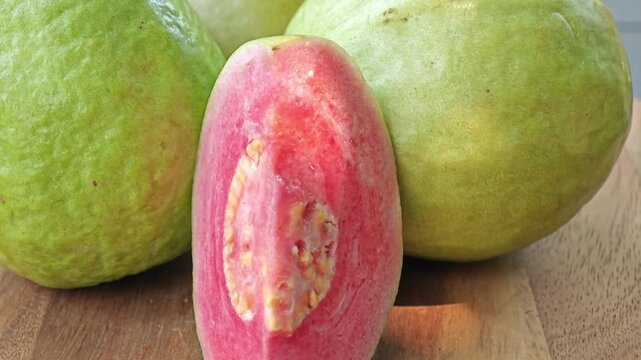 Pink guava on wooden board. 