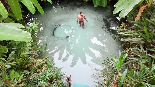 Man Floating in Fervedouro Spring, Jalap&atilde;o State Park, Brazil - Aerial View