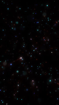 Abstract colorful starfield with glowing particles and twinkling lights scattered across deep black space