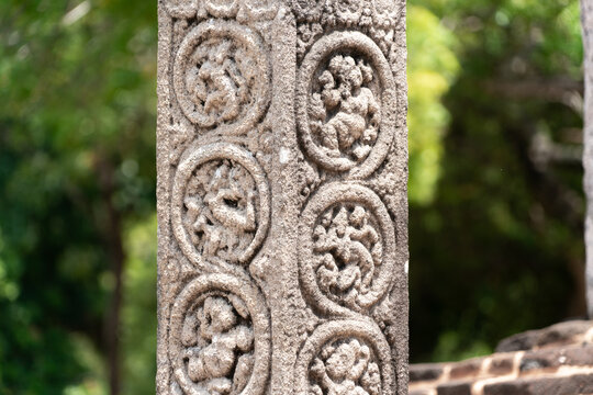 Decorated pillar with stone carvings in the Sacred Quadrangle, Pollonaruwa, Sri Lanka 