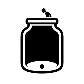 Man looking into empty jar closely.