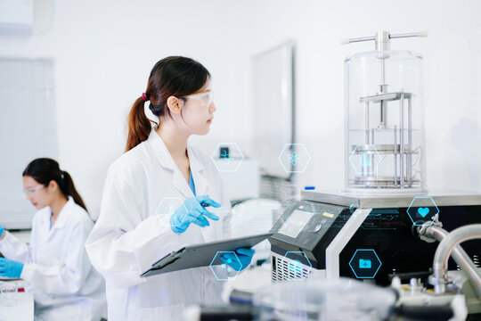 Medical scientists performing biotechnology laboratory research with DNA molecular analysis, microscope testing