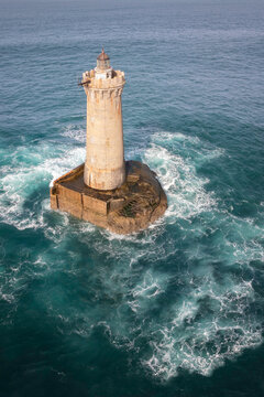 Phare au milieu de l'oc&eacute;an en vue aerienne verticale, le phare du Four en Bretagne dans le Finist&egrave;re au large de Porspoder. 