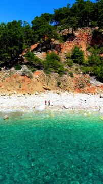 Experience the serene charm of Kargili Creek Beach in Mavikent, Turkey. a couple of man and woman on a vacation road trip in Turkey