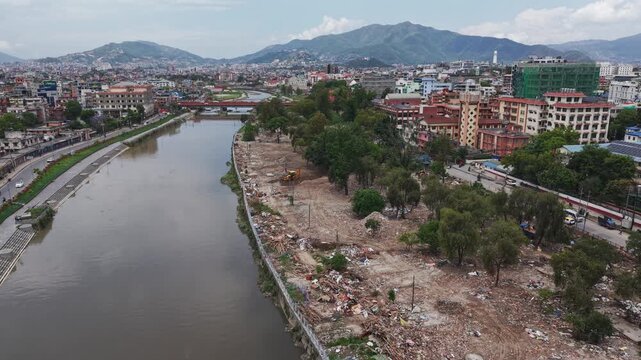 Footage of cleared squatter settlements in Kathmandu. Captures temporary housing destruction, scattered debris, and changing urban landscape.