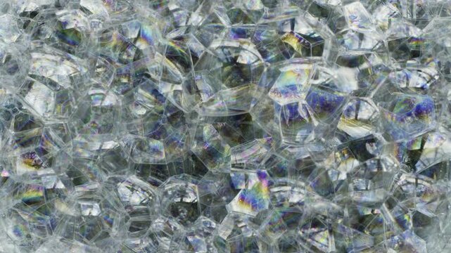 Close-up of Iridescent Soap Bubbles Shifting and Popping.
A high-detail macro shot of a dense cluster of soap bubbles.