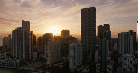 Fototapeta premium Miami skyline with skyscrapers and waterfront at sunset
