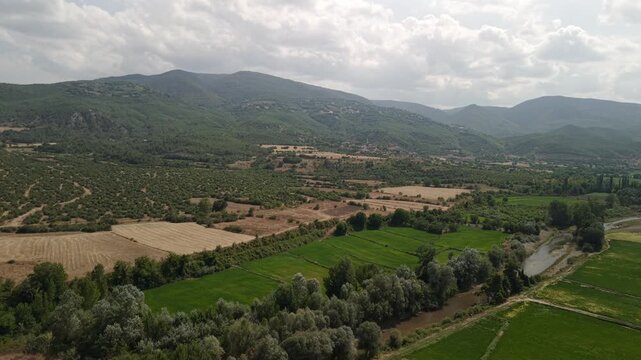 Aerial front view of green mountains and rural fields in Cide, Kastamonu, Black Sea region, Turkey.