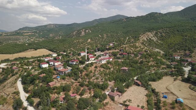 Drone orbit shot of Cide coastal town with mosque and traditional houses, Kastamonu, Turkey.