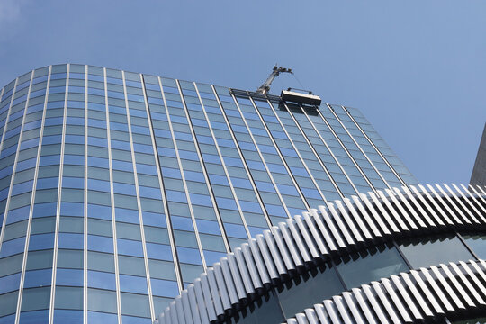 TOKYO, JAPAN - May 14, 2026: Detail of the under-construction Tokyo Midtown Nihonbashi including the 52-floor Nihonbashi Nomura Mitsui Tower. There is building cradle at the top.