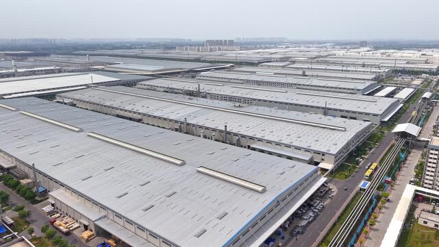Aerial View of a Large Modern Industrial Factory Complex with Warehouses