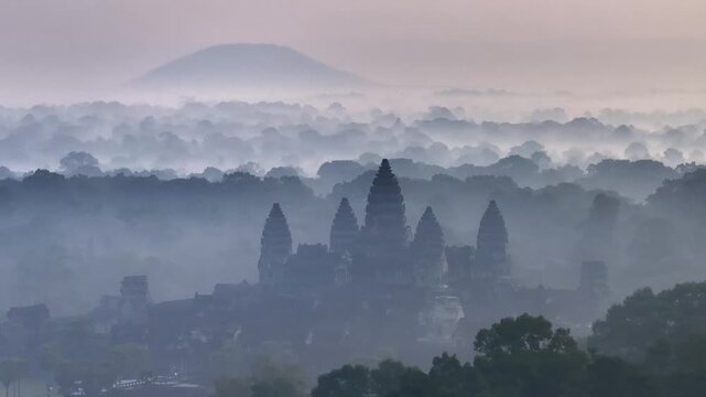 SIlhouette of the Majestic Angkor Wat temple complex in cambodia at Sunrise. UNESCO World Heritage Site. Aerial View.