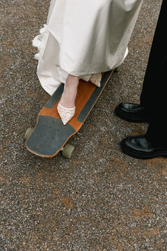 bride dress shoes skateboard shoes pavement ground
